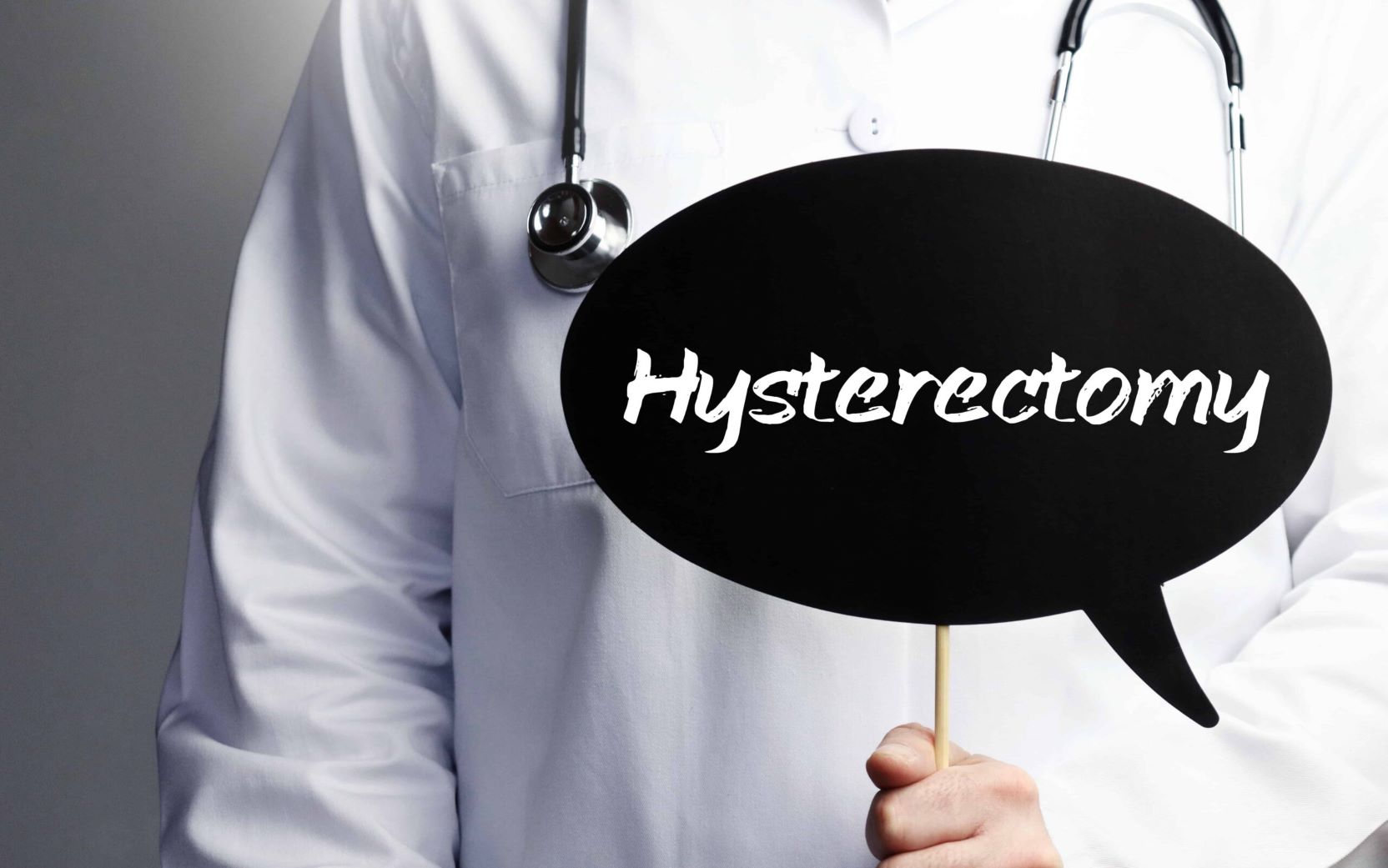 Doctor holding board of Hysterectomy | Dallas, TX